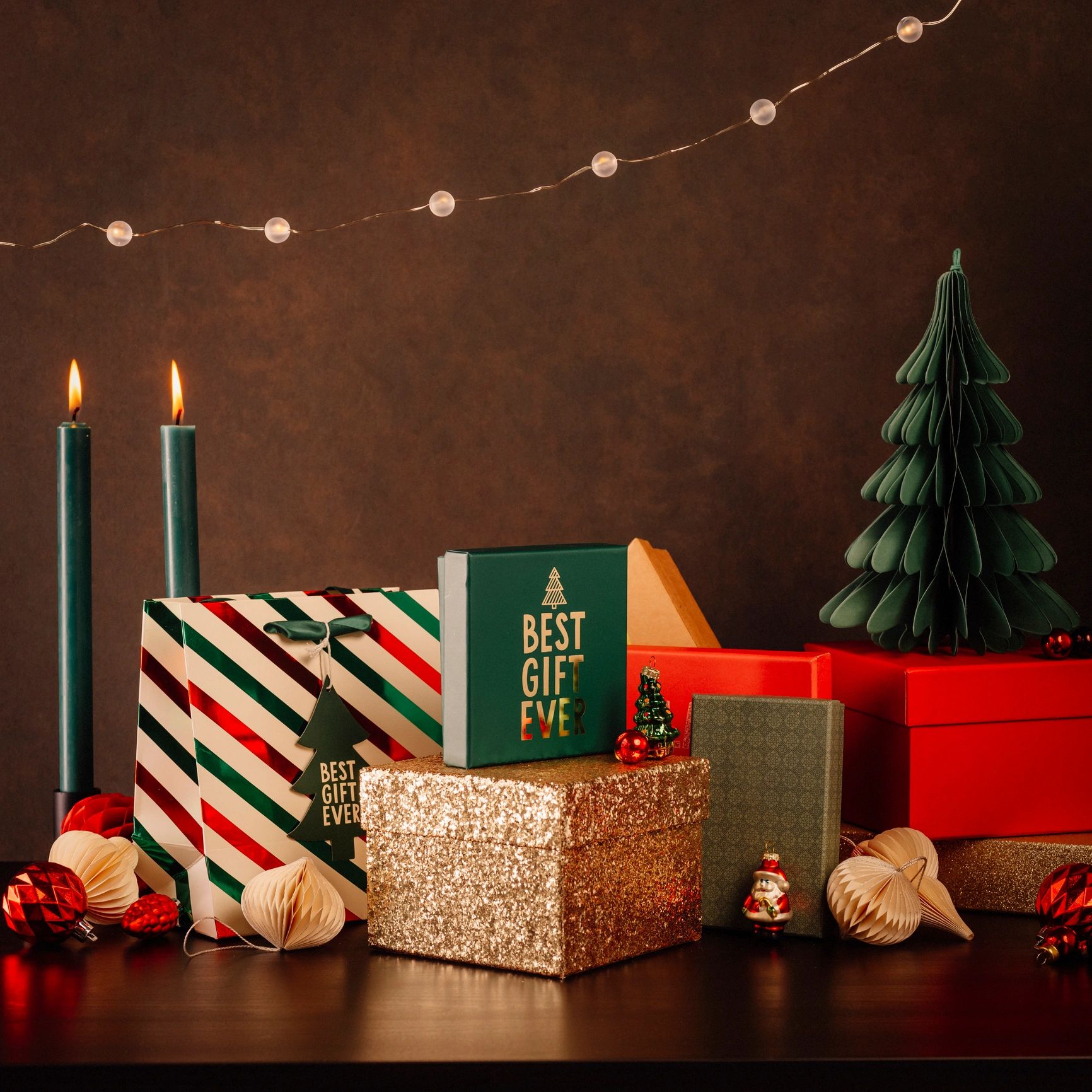 Christmas still life with gifts and candlelight