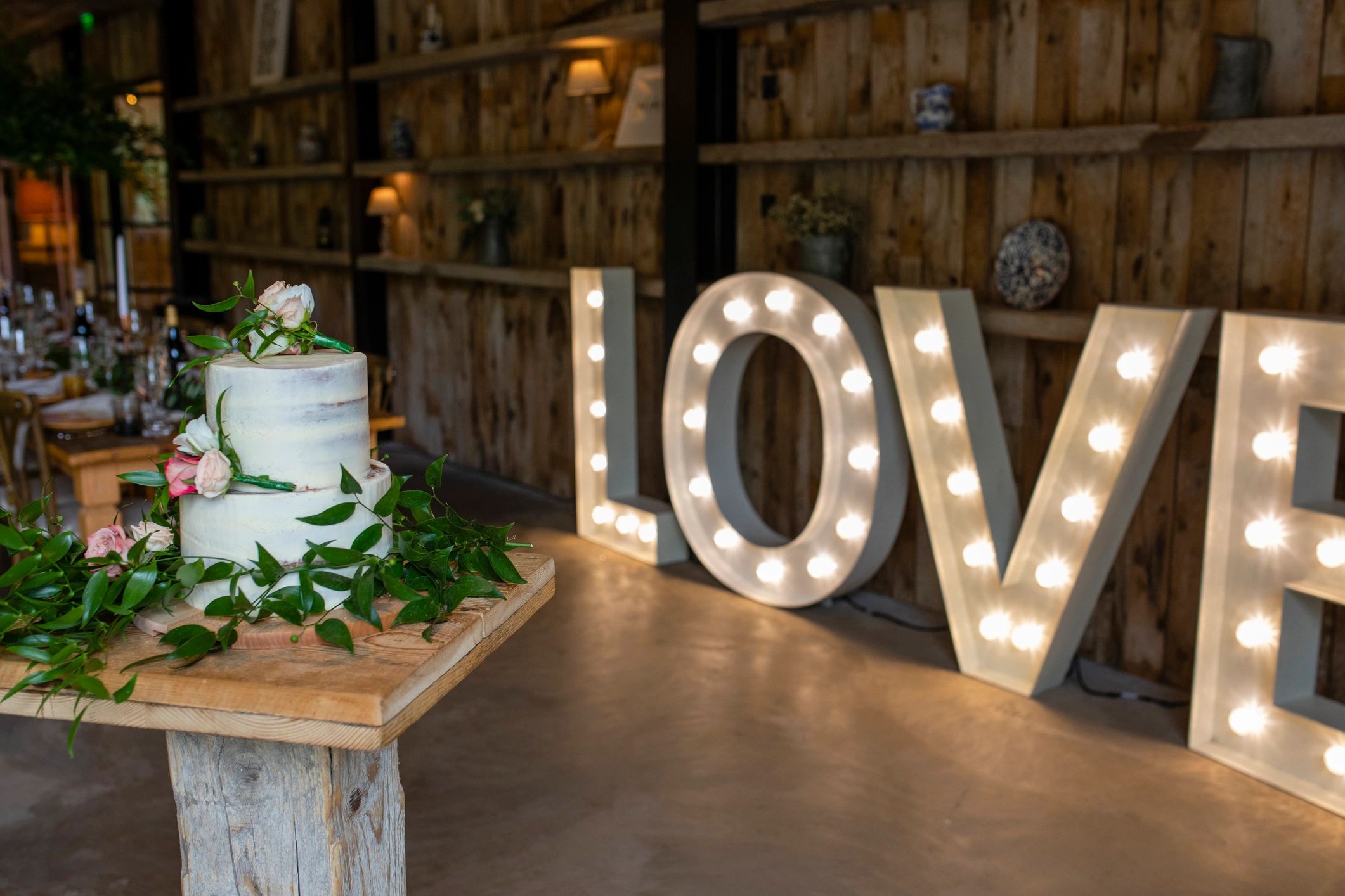 Elegant wedding celebration display with cake and decor
