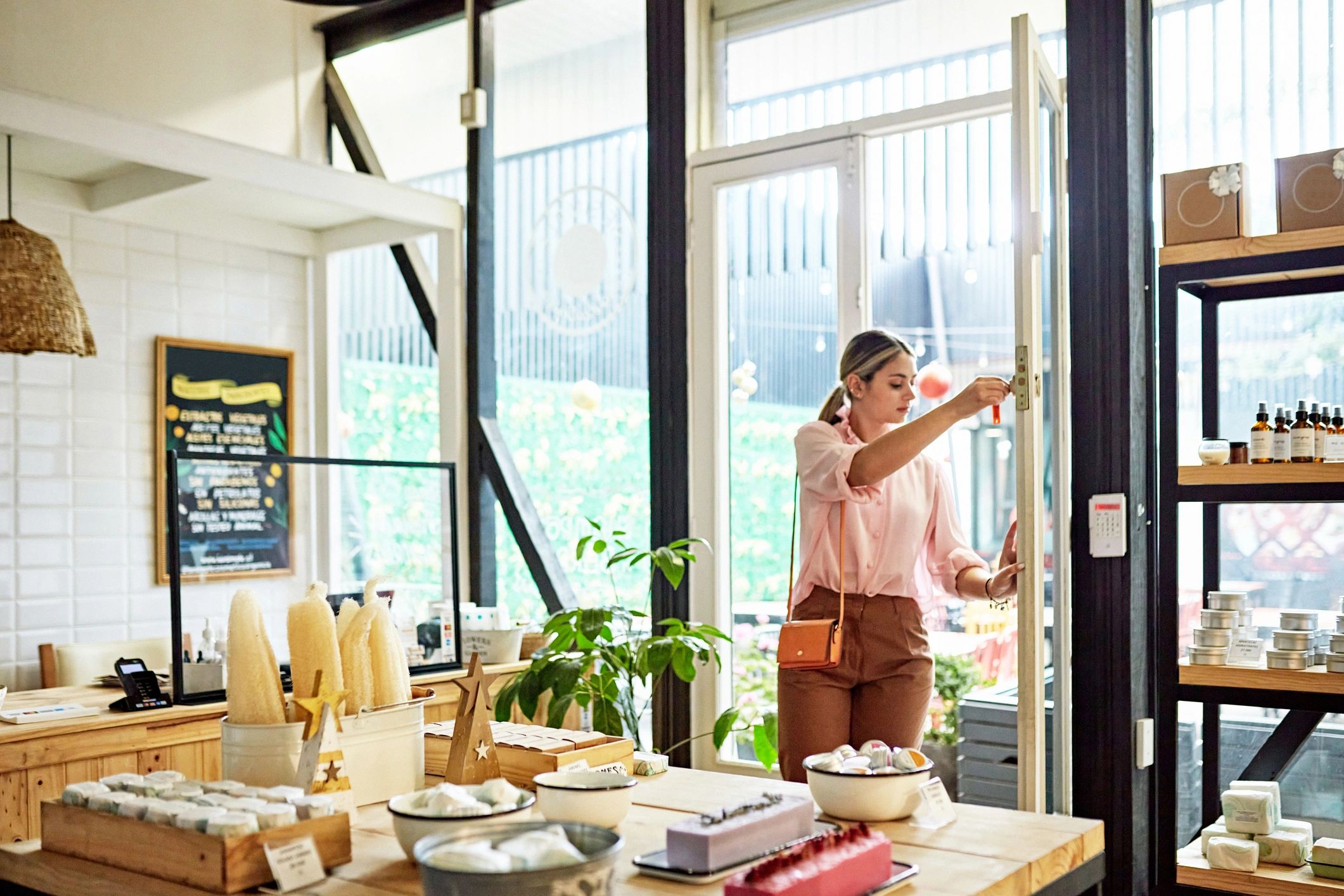 Gift shop owner opening a welcoming boutique